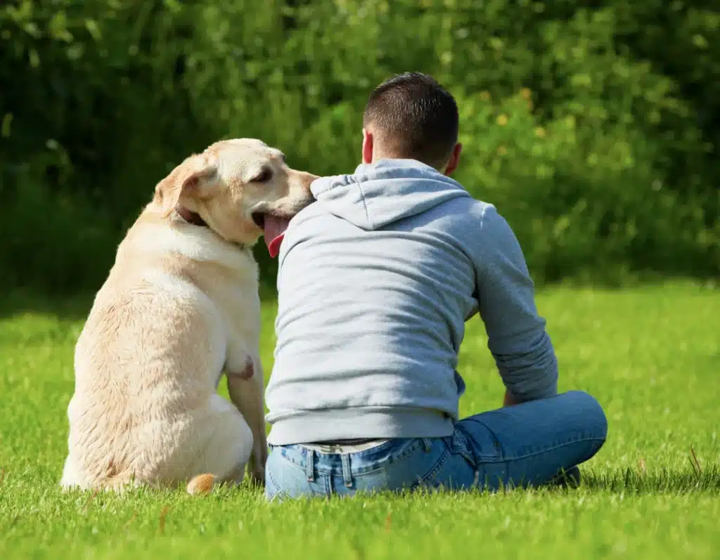 Man relaxes with his dog-Pets and mental health Man relaxes with his dog-Pets and mental health