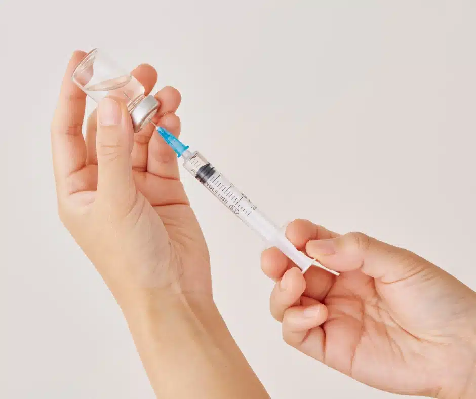Vaccinations-drawing medicine into needle Vaccinations-drawing medicine into needle
